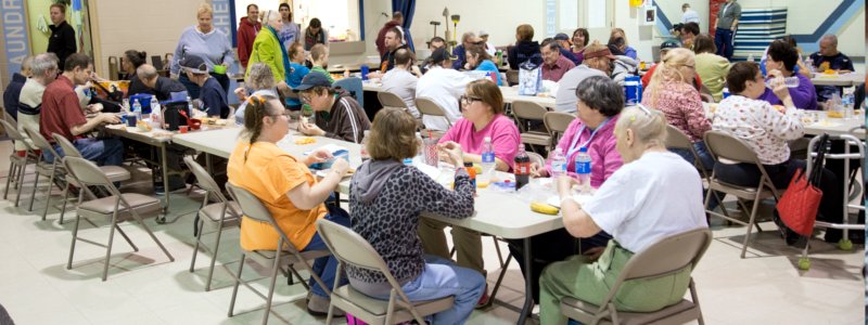 Large group of people eating.